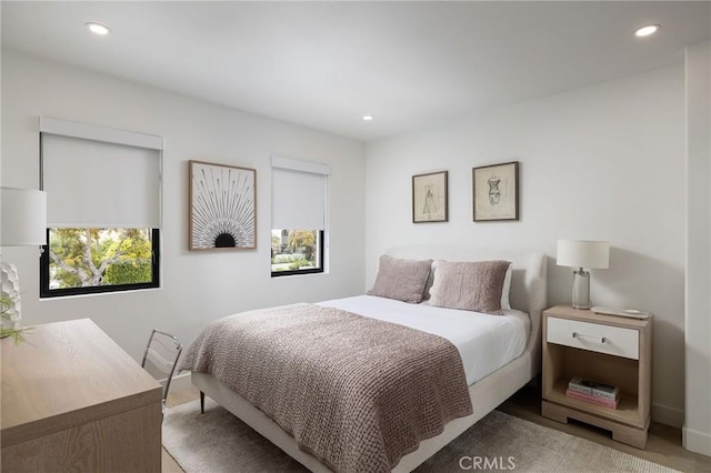 bedroom featuring baseboards and recessed lighting