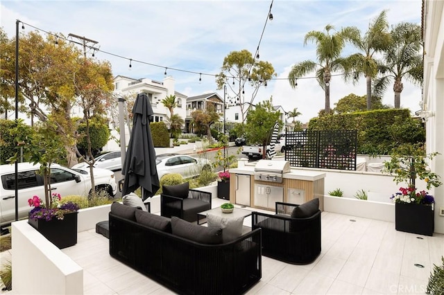 view of patio with an outdoor hangout area and grilling area