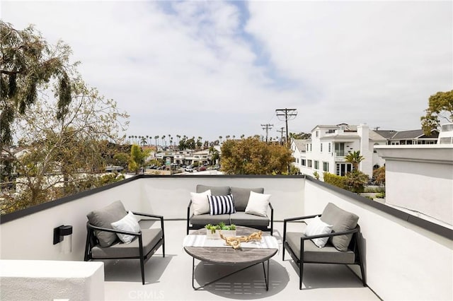 balcony with an outdoor hangout area and a residential view