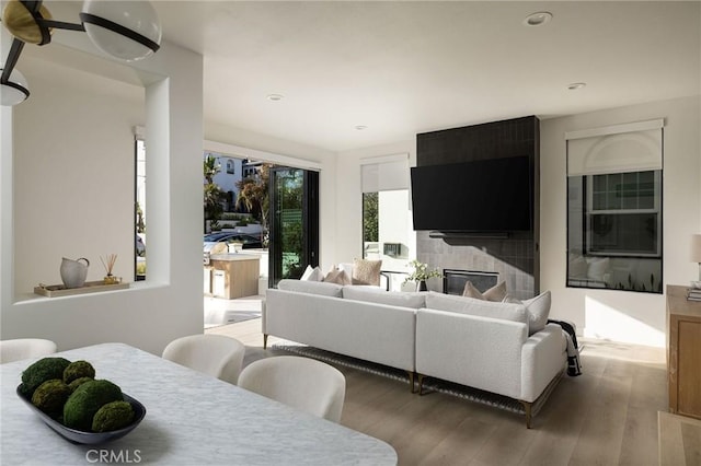502 Jasmine Ave Unit A, Corona Del Mar, CA 92625 - living area with wood finished floors, a large fireplace, and recessed lighting