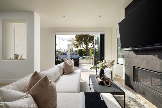502 Jasmine Ave Unit A, Corona Del Mar, CA 92625 - living room featuring a tiled fireplace, light wood-type flooring, and recessed lighting