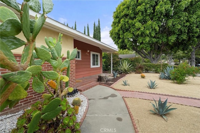 view of side of property with a patio area