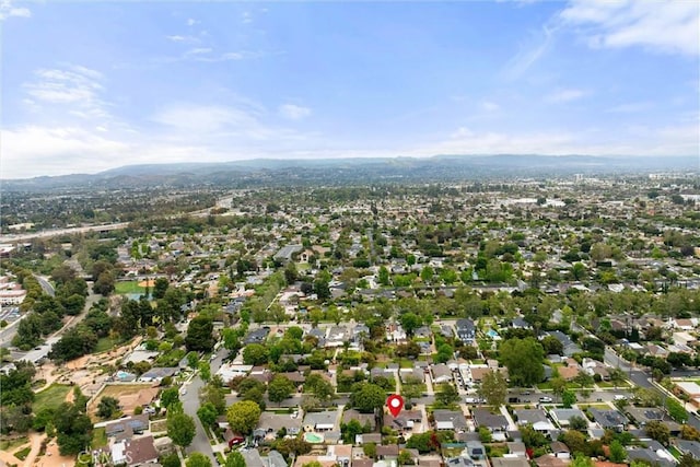 birds eye view of property with a mountain view and a residential view