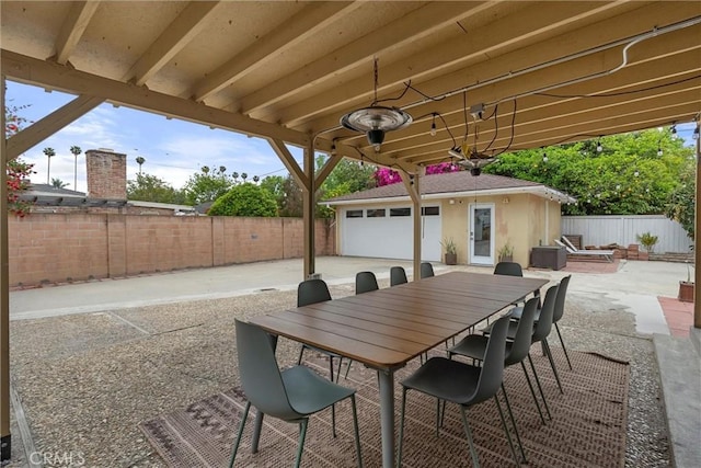 view of patio featuring a fenced backyard and an outbuilding