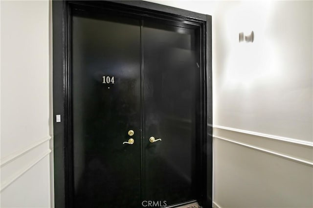 view of exterior entry featuring french doors