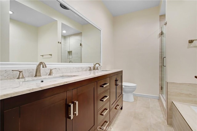 full bathroom with a sink, toilet, and a stall shower