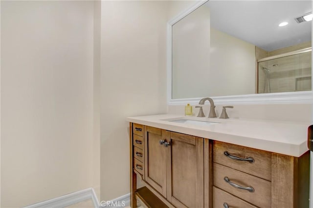 bathroom featuring a shower stall, visible vents, vanity, and recessed lighting
