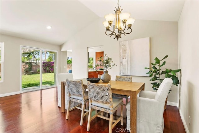 dining room featuring lofted ceiling, baseboards, an inviting chandelier, and wood finished floors
