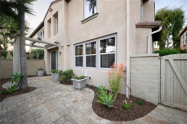 exterior space featuring a gate and fence