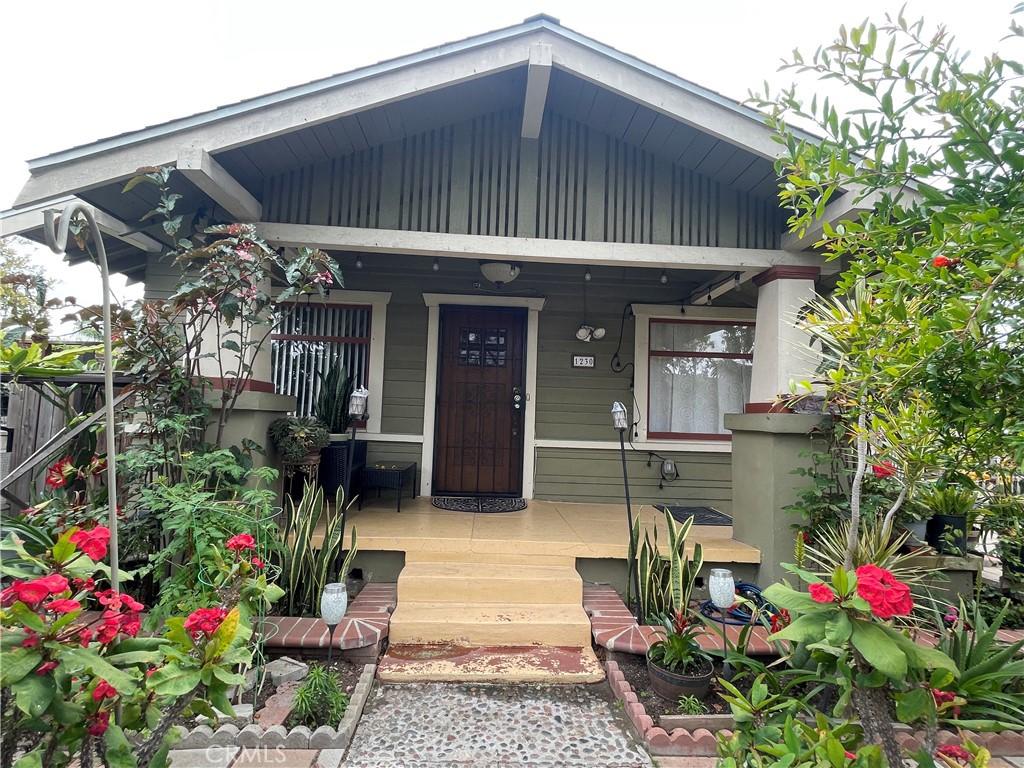 view of exterior entry with covered porch
