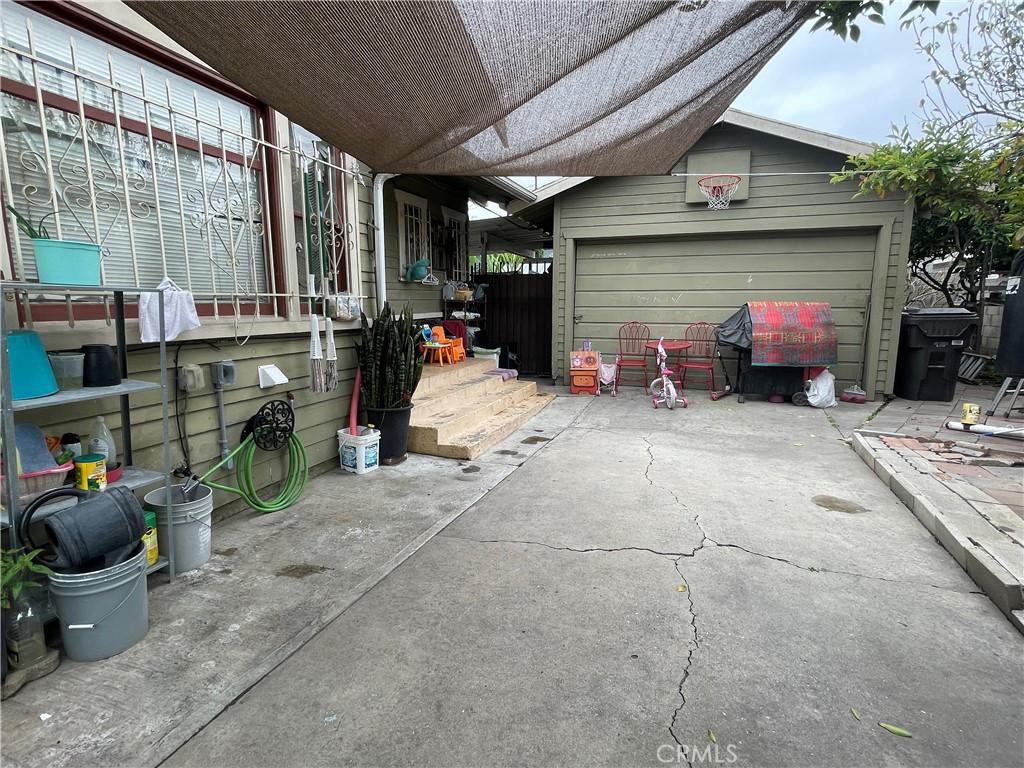 view of patio with driveway and an attached garage