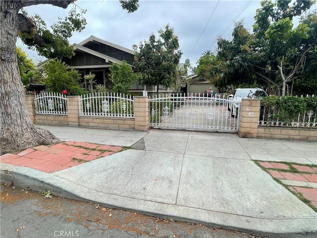 view of gate featuring a fenced front yard
