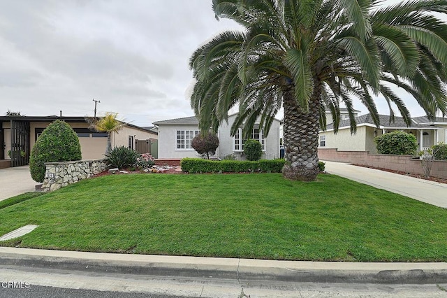 2030 Lomita Park Pl, Lomita, CA 90717 - view of front of home featuring a front lawn, stucco siding, driveway, and an attached garage