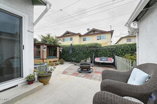 2030 Lomita Park Pl, Lomita, CA 90717 - view of patio with an outdoor fire pit, a hot tub, fence, and cooling unit