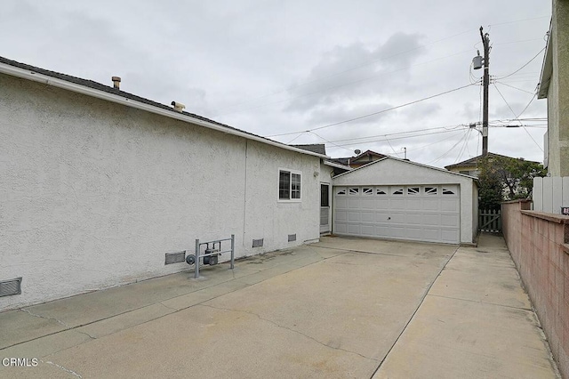 2030 Lomita Park Pl, Lomita, CA 90717 - view of home's exterior with crawl space, stucco siding, a detached garage, and an outdoor structure