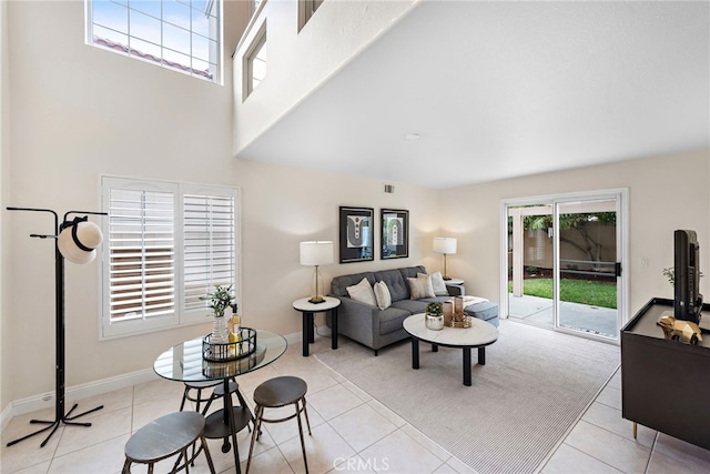 30 Calle Estero, Rancho Santa Margarita, CA 92688 - living area with light tile patterned floors, a high ceiling, and baseboards