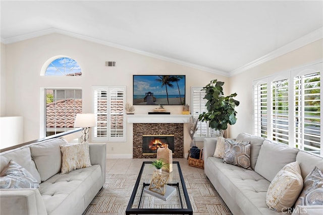 30 Calle Estero, Rancho Santa Margarita, CA 92688 - living area featuring vaulted ceiling, a high end fireplace, light tile patterned floors, crown molding, and baseboards