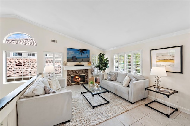 30 Calle Estero, Rancho Santa Margarita, CA 92688 - living room with vaulted ceiling, a glass covered fireplace, light tile patterned flooring, baseboards, and ornamental molding