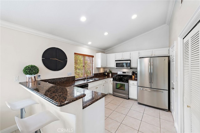 30 Calle Estero, Rancho Santa Margarita, CA 92688 - kitchen featuring appliances with stainless steel finishes, a sink, crown molding, a peninsula, and white cabinetry