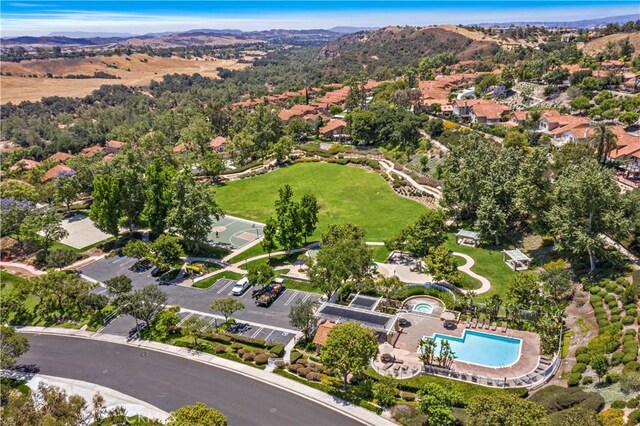 30 Calle Estero, Rancho Santa Margarita, CA 92688 - aerial overview of property's location featuring a pool area and a mountain backdrop