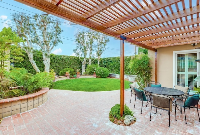 view of patio featuring a pergola and outdoor dining space