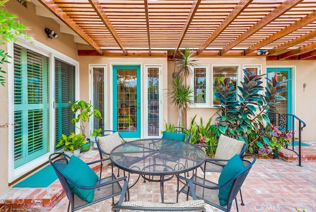 view of patio featuring a pergola and outdoor dining area
