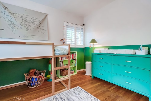 bedroom featuring wood finished floors