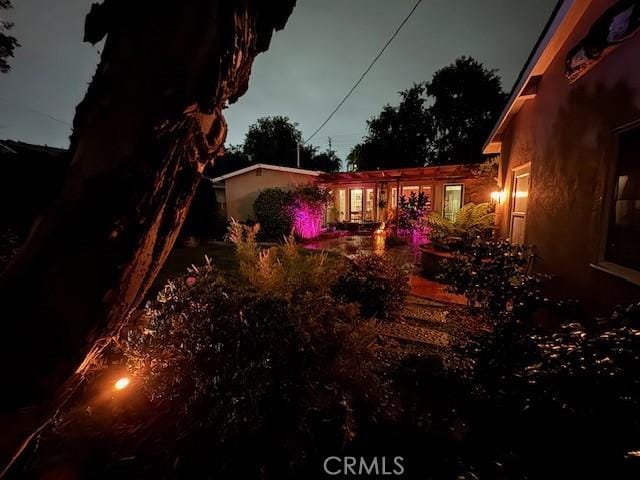 view of yard at twilight