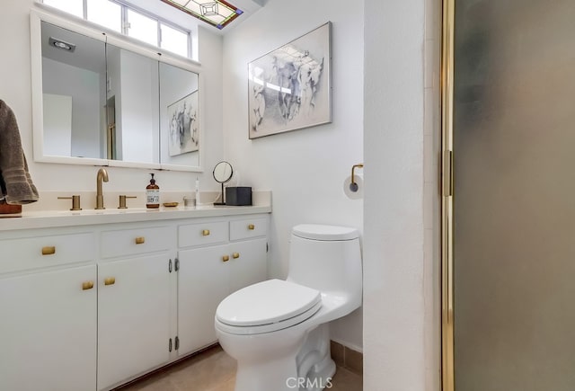 full bath featuring vanity, toilet, an enclosed shower, and tile patterned flooring