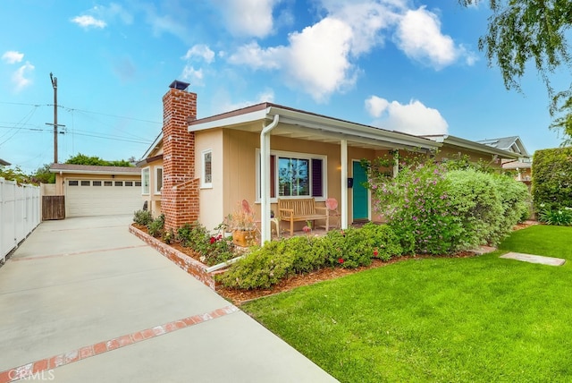 ranch-style house featuring a garage, a chimney, fence, a front yard, and a porch
