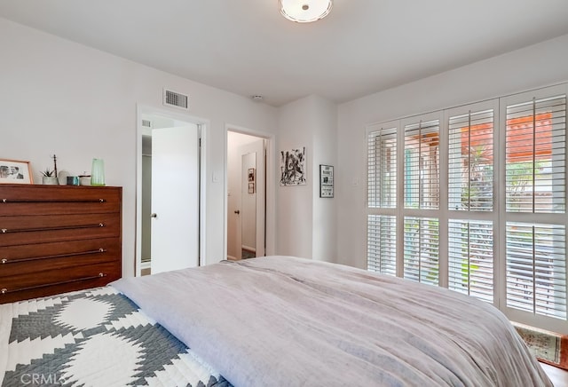 bedroom featuring visible vents
