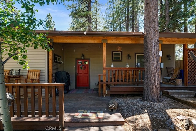 back of house featuring covered porch