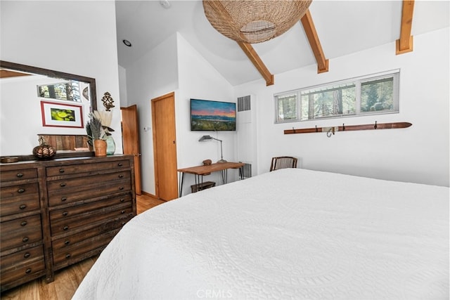 bedroom featuring light wood-style flooring, high vaulted ceiling, and beam ceiling