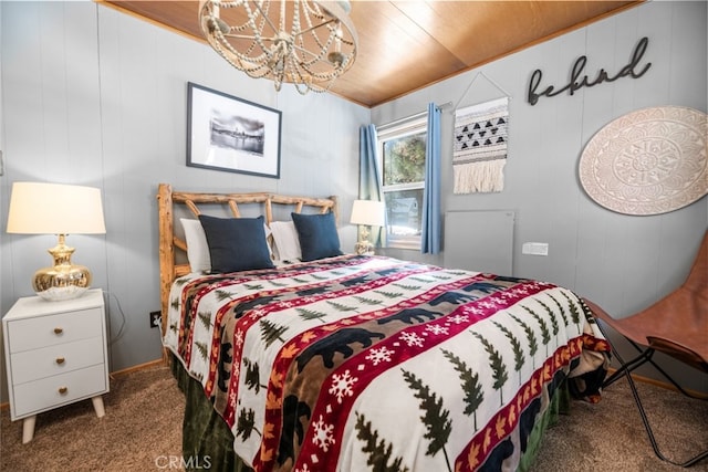 bedroom featuring carpet and a notable chandelier