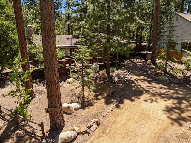 view of yard featuring a wooden deck