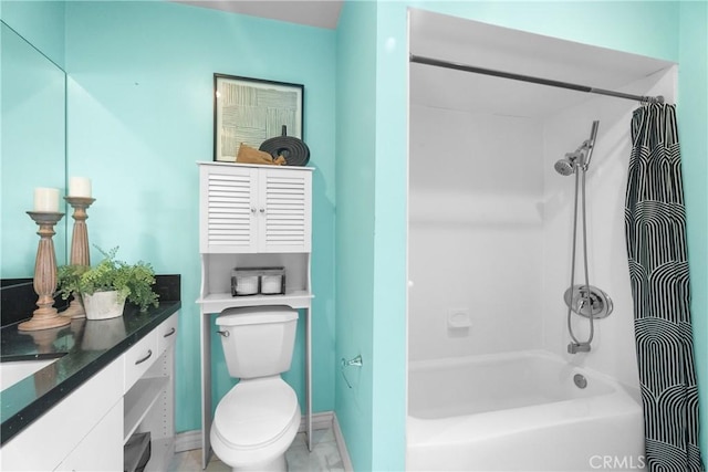 bathroom with toilet, shower / tub combo, and vanity