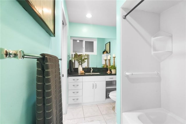 bathroom with toilet, vanity, and tub / shower combination