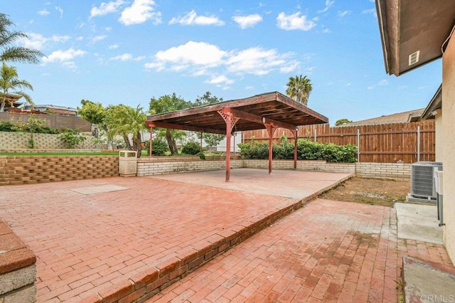 view of patio / terrace with central air condition unit and fence