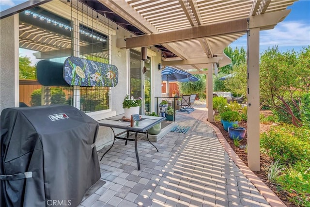 view of patio / terrace featuring a pergola, grilling area, and outdoor dining space