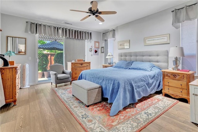 bedroom with a ceiling fan, recessed lighting, visible vents, light wood-style floors, and access to exterior