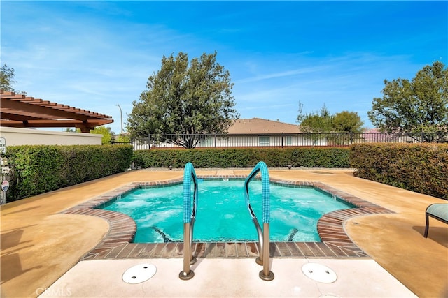 view of pool with a patio and fence
