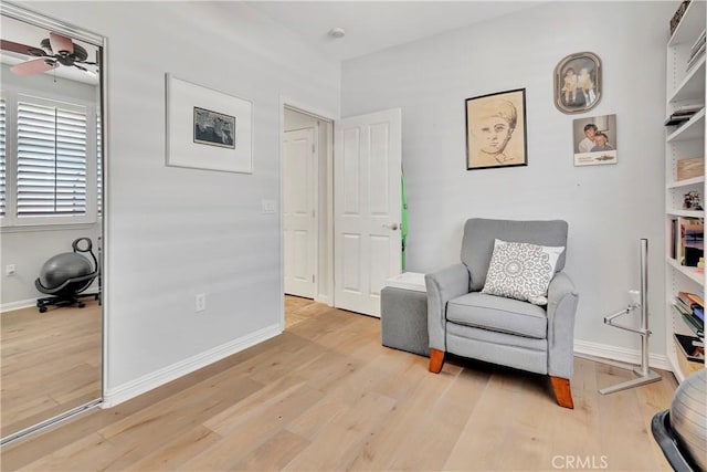 2673 Traditions Loop, Paso Robles, CA 93446 - living area featuring light wood-style flooring, baseboards, and a ceiling fan