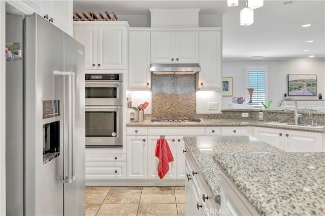 kitchen featuring white cabinets, stainless steel appliances, and a sink