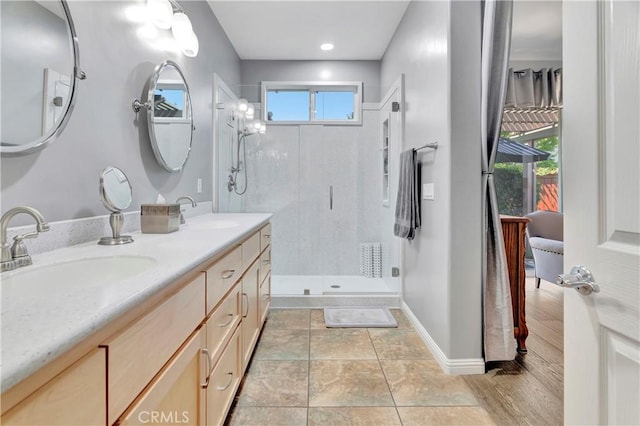 2673 Traditions Loop, Paso Robles, CA 93446 - full bath with a shower stall, double vanity, and baseboards
