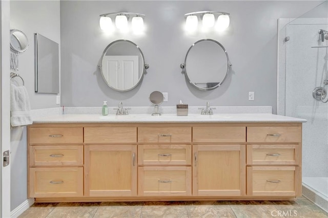 full bath with walk in shower, double vanity, and a sink