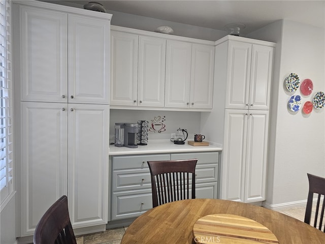 2673 Traditions Loop, Paso Robles, CA 93446 - kitchen featuring white cabinets, light countertops, and baseboards