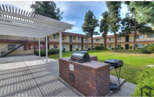 4700 Clair Del Ave Unit 620, Long Beach, CA 90807 - view of patio featuring a pergola and an outdoor kitchen