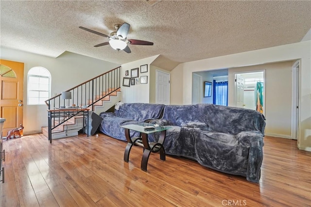 49604962 Gambier St, Los Angeles, CA 90032 - living area with a textured ceiling, stairway, wood finished floors, and ceiling fan