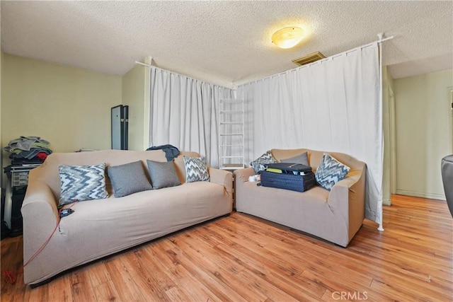 49604962 Gambier St, Los Angeles, CA 90032 - living area featuring a textured ceiling and light wood-style flooring