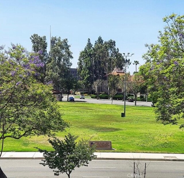 view of home's community featuring a lawn